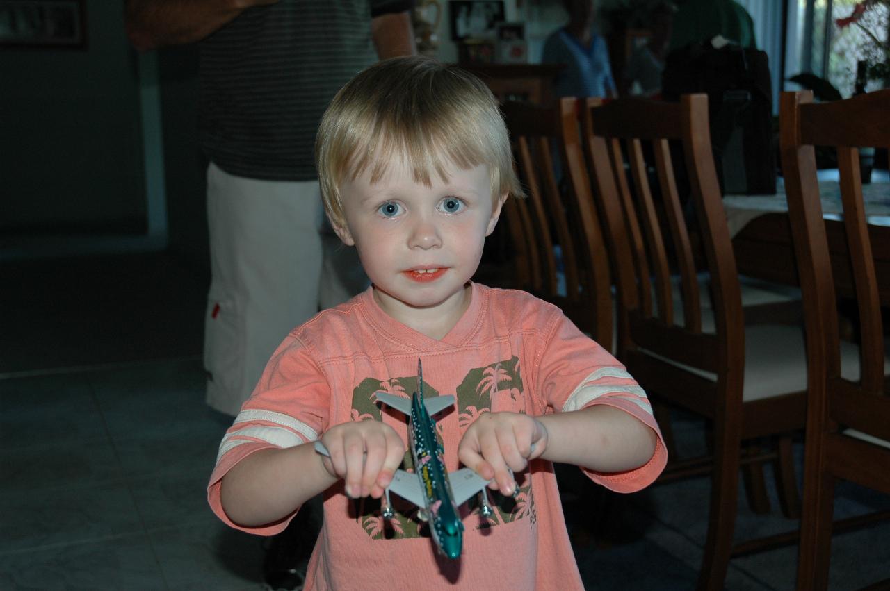 Cooper's First Birthday: Flynn with his aeroplane present