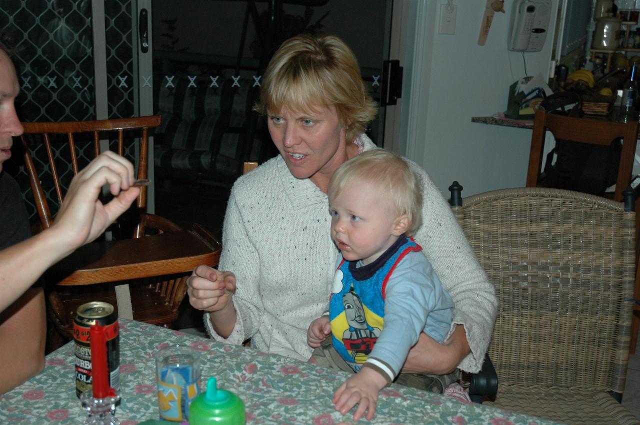 Peter's 66th Birthday: Glenn offering Cooper a piece of chocolate from the cake