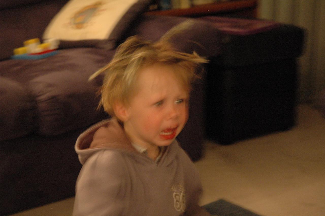 Unhappy little boy with spikey hair