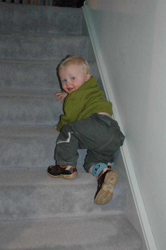 Baby descending stair, half way down