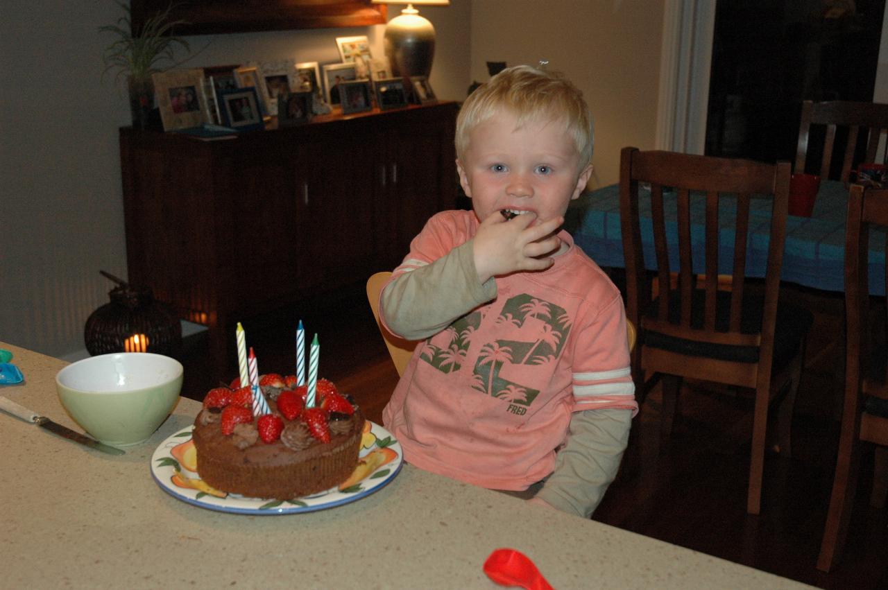 Glenn Wallace 39th birthday: Cooper helping himself to the cake, even before the candles have been lit