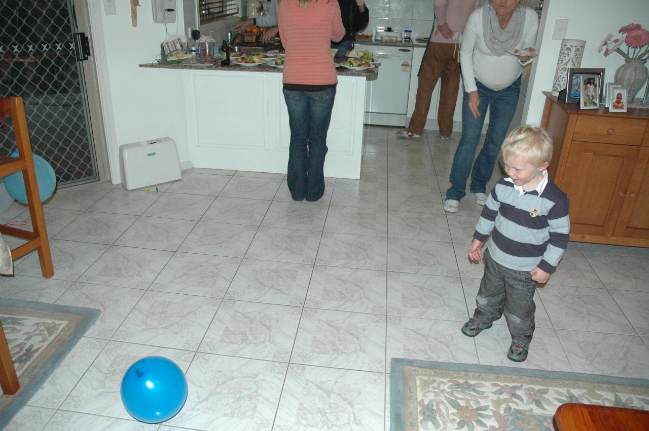 Jake Croft's 7th birthday: Cooper watching the ballon fly around; Kelly looking on, Cameron has just let the balloon go