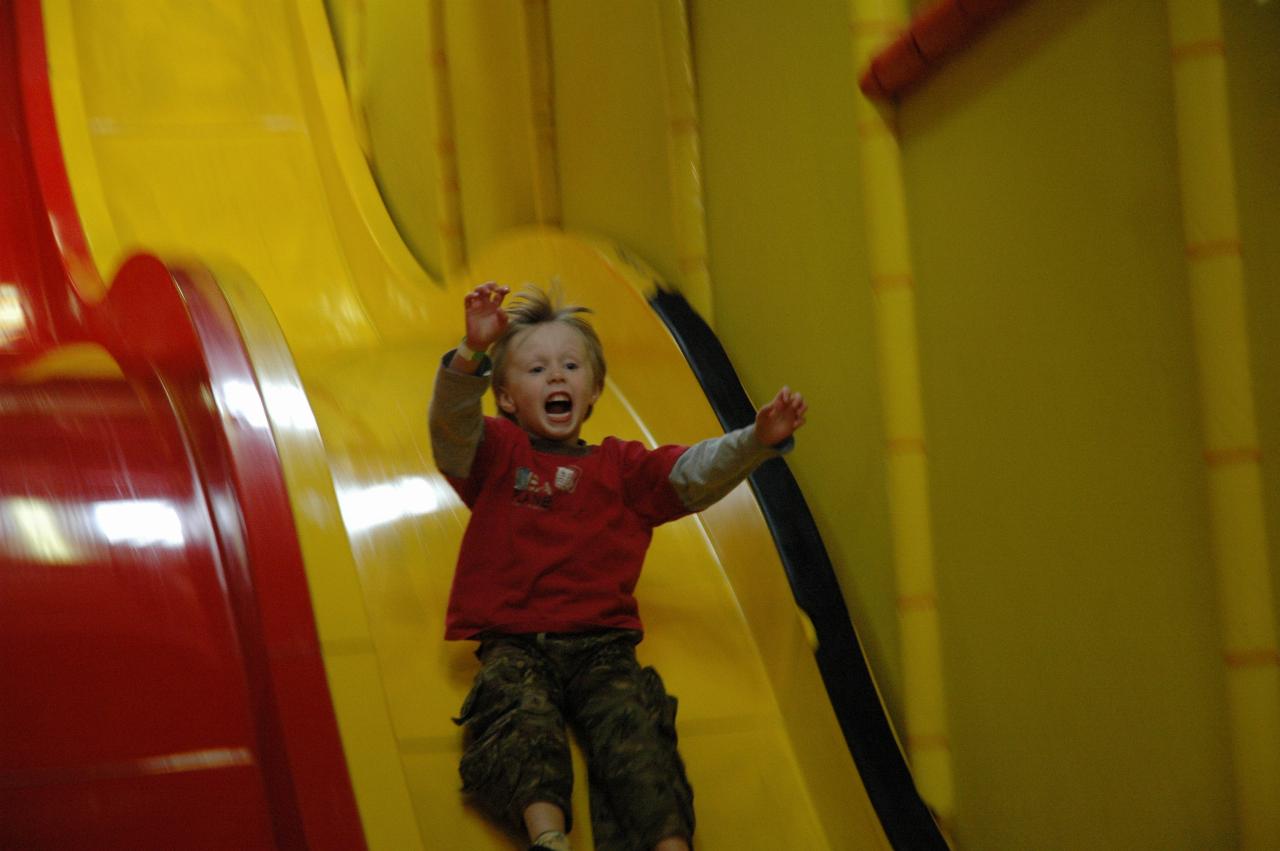 Jake's 7th birthday party at Club Kids, Earlwood: Flynn on the slippery dip