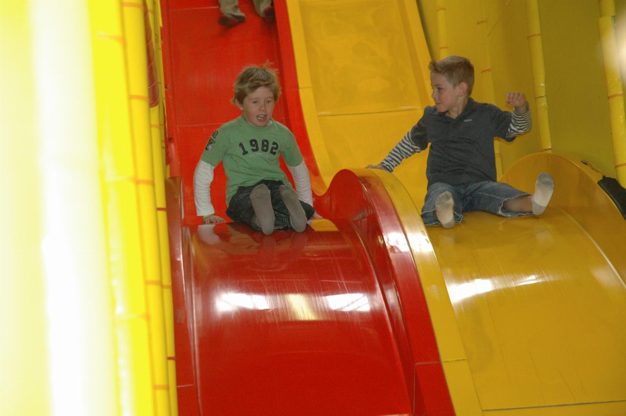 Jake's 7th birthday party at Club Kids, Earlwood: Jake and friend sliding together