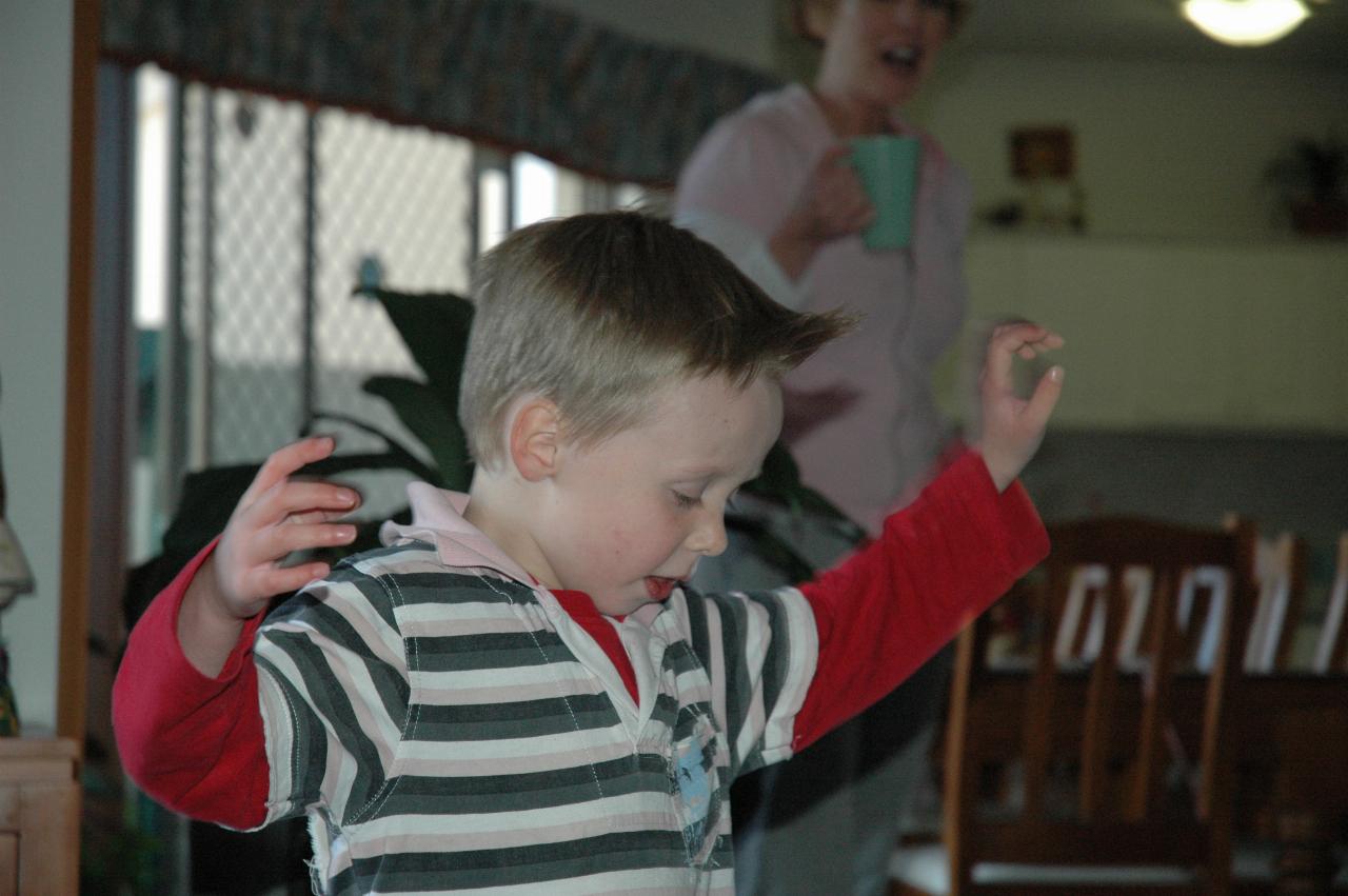 Flynn Crofts in happy mood at Illawong; Michelle in background