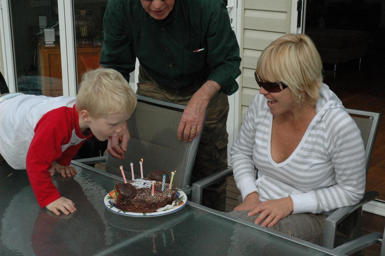 Cooper blowing out the candles for Kelly on her 39th birthday