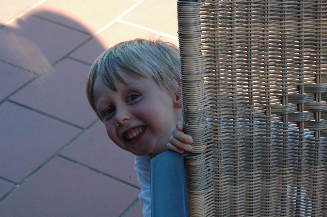 Christmas dinner at Illawong: Flynn hiding behind the chair