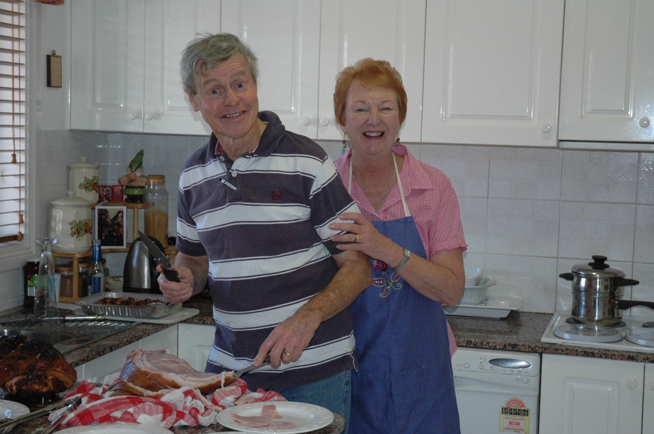 Christmas dinner at Illawong: Peter and Yvonne hamming it up in the kitchen