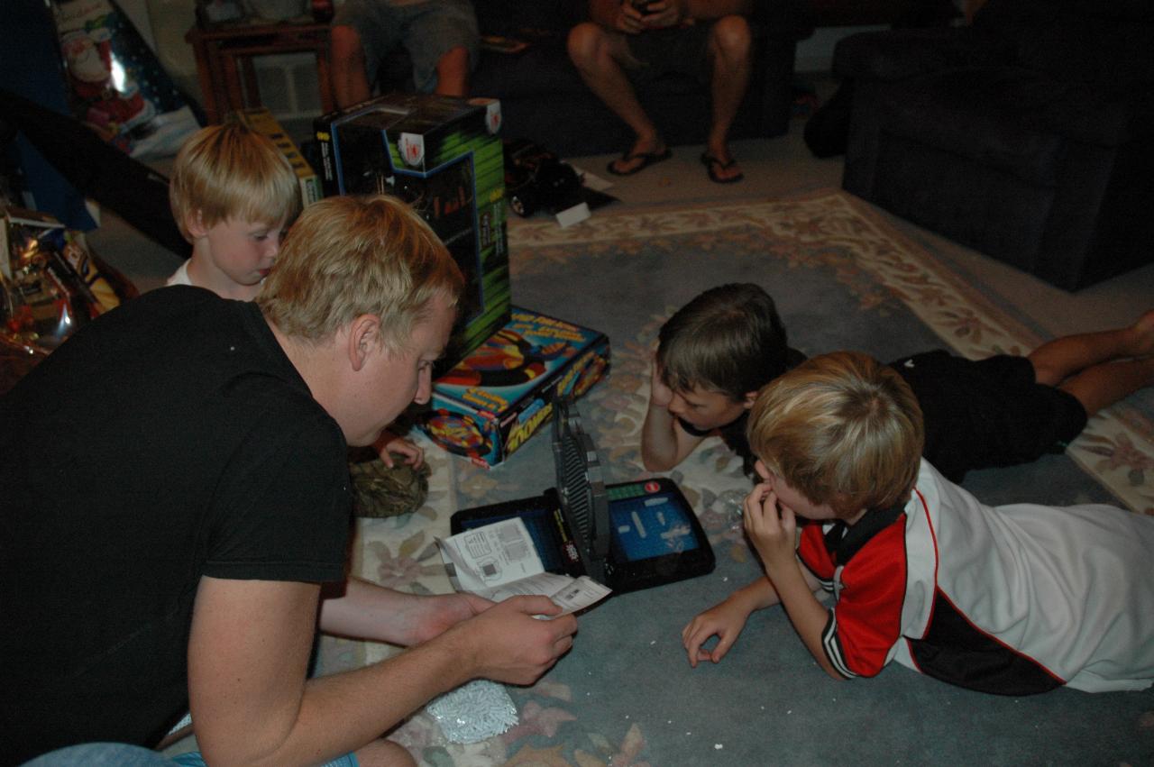 Christmas dinner at Illawong: Keiran, Flynn, Tynan and Jake sorting out battleship game