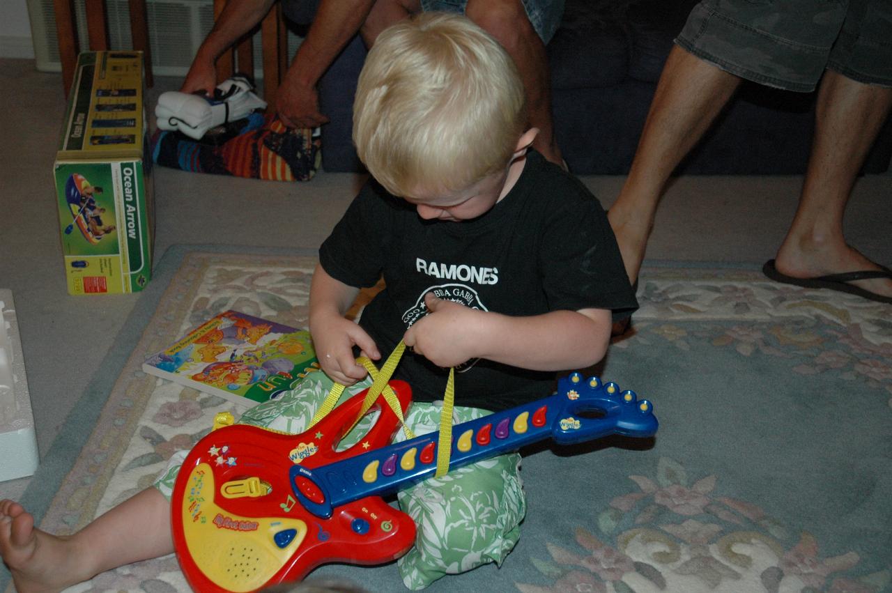 Christmas dinner at Illawong: Cooper's guitar harness is all tangled