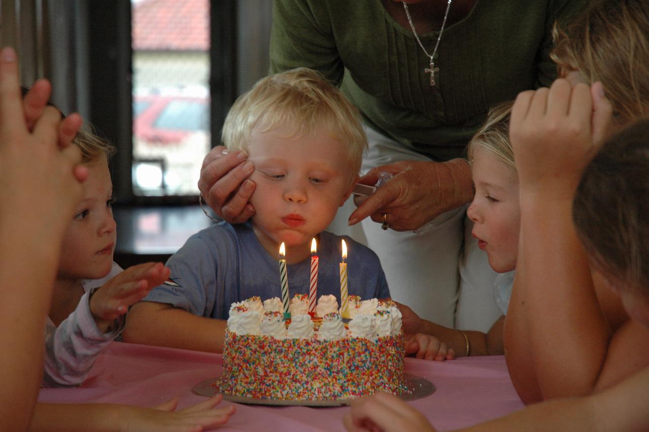 Cooper's 3rd birthday: Singing done, blow the candles out