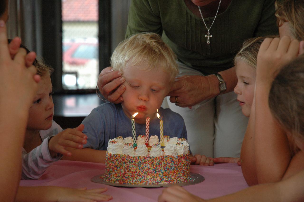 Cooper's 3rd birthday: Singing done, blow the candles out