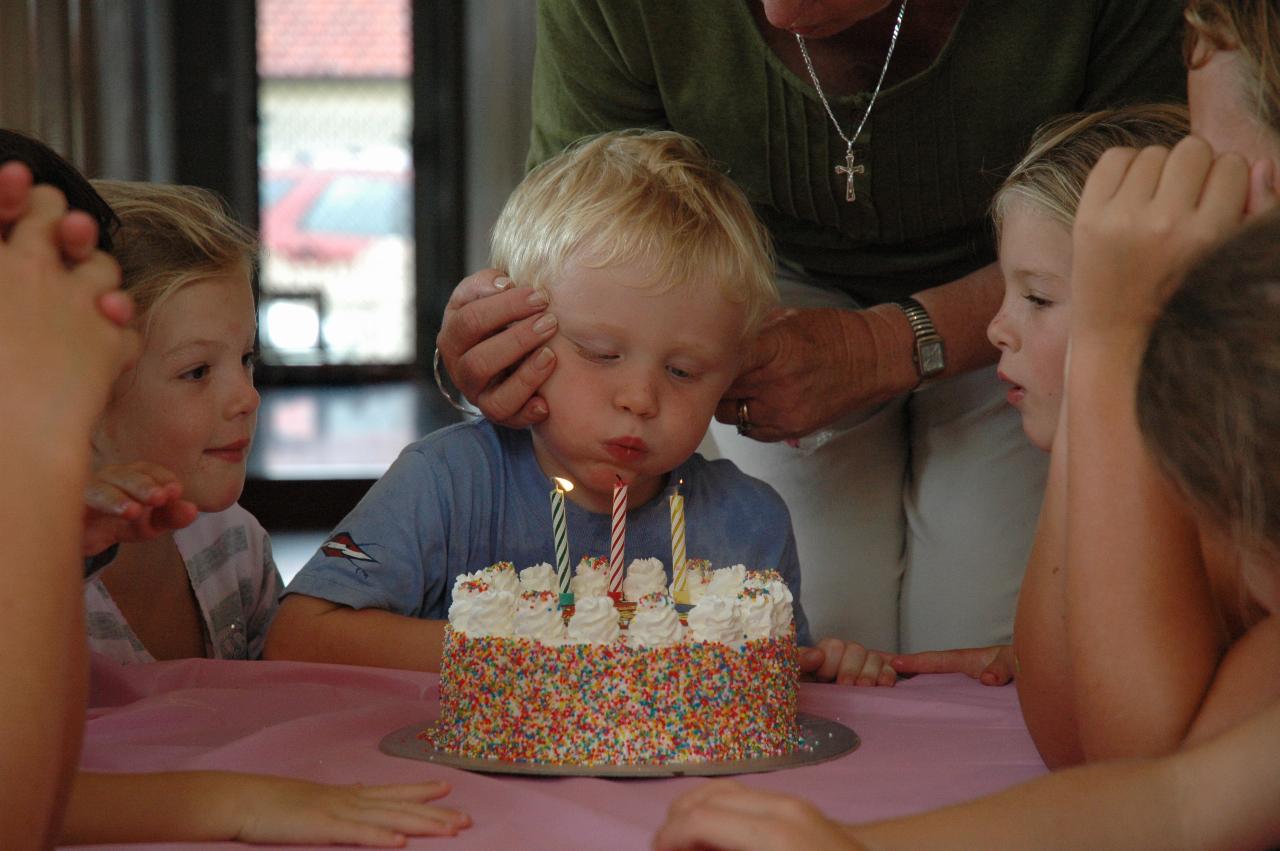 Cooper's 3rd birthday: Singing done, blow the candles out