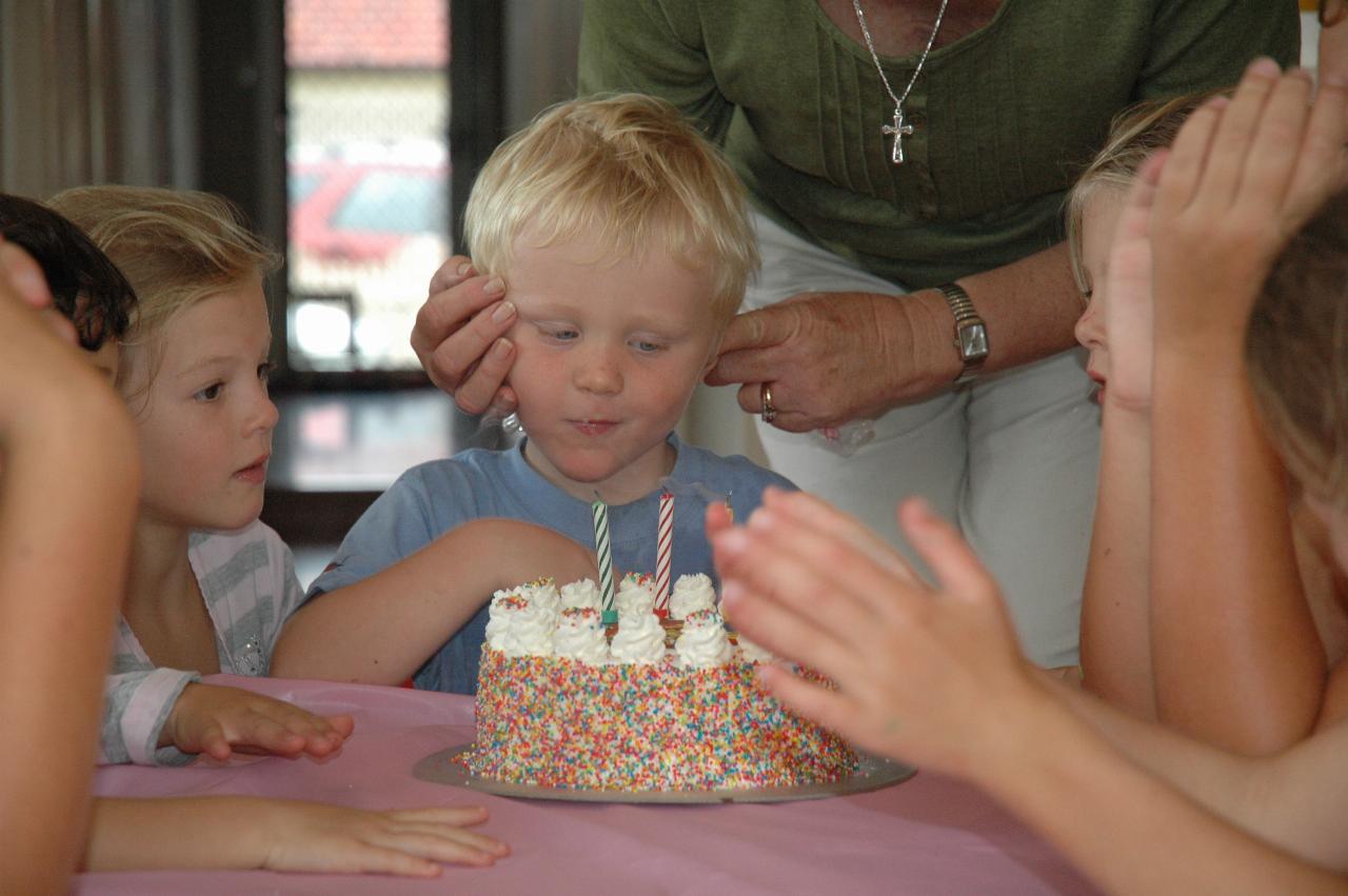 Cooper's 3rd birthday: Singing done, blow the candles out