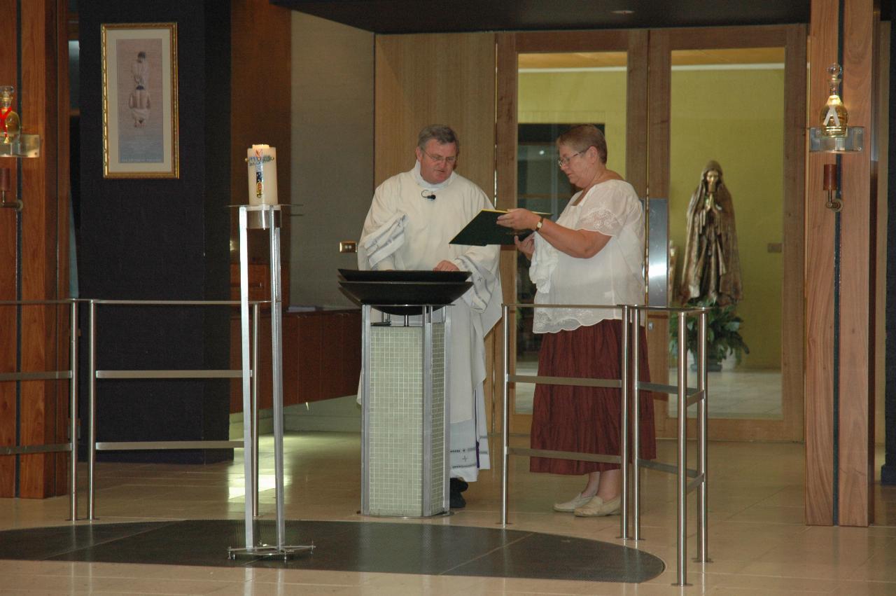 Lily's Baptism: Father Glen blessing the Baptismal water