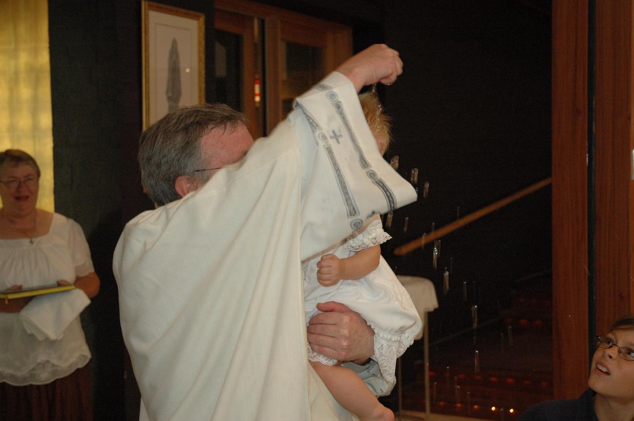 Lily's Baptism: Father Glen baptising Lily; Tynan on the right