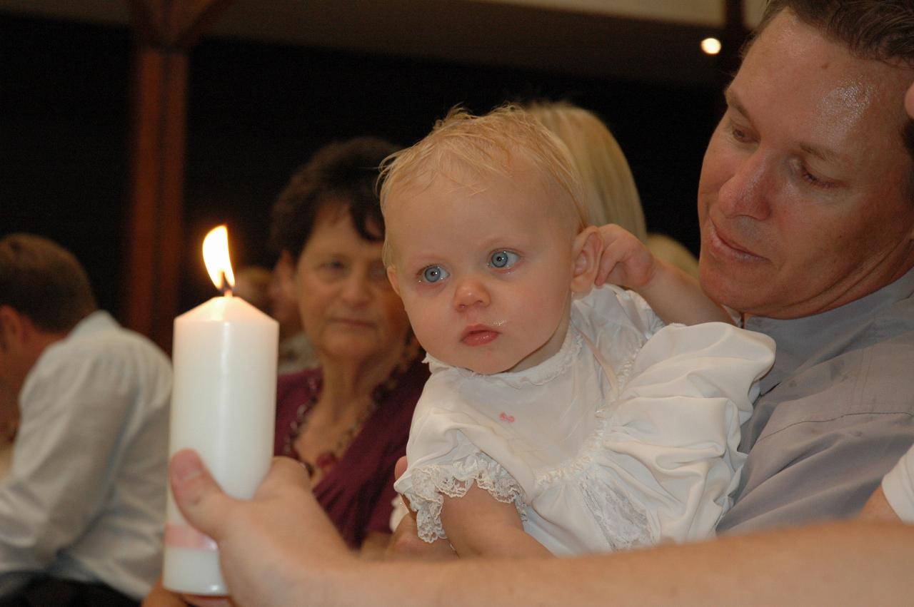 Lily's Baptism: Lily intrigued by the candle