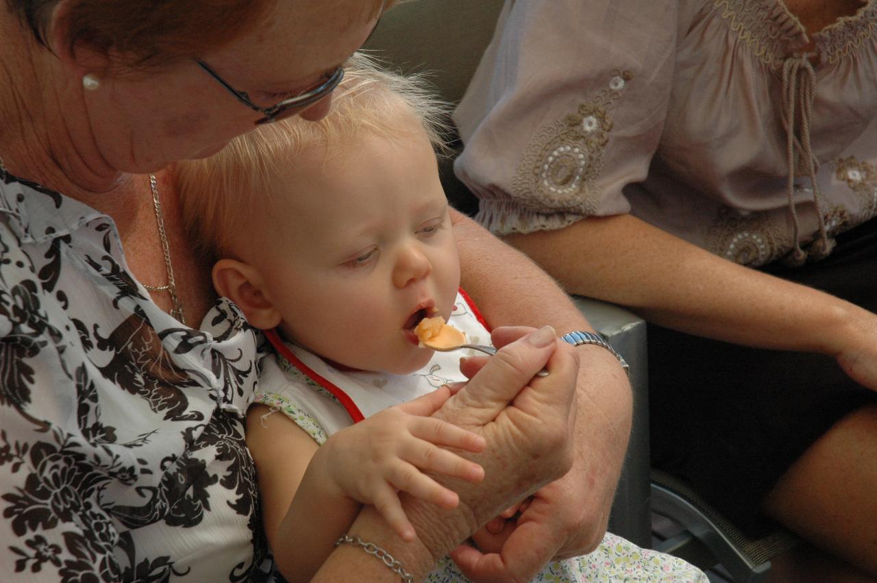 Lily's Baptism: Yvonne feeding Lily