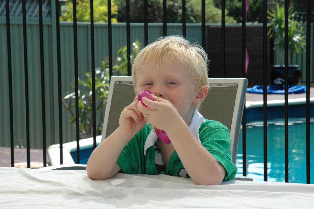 Lily's Baptism: Cooper with a water pistol