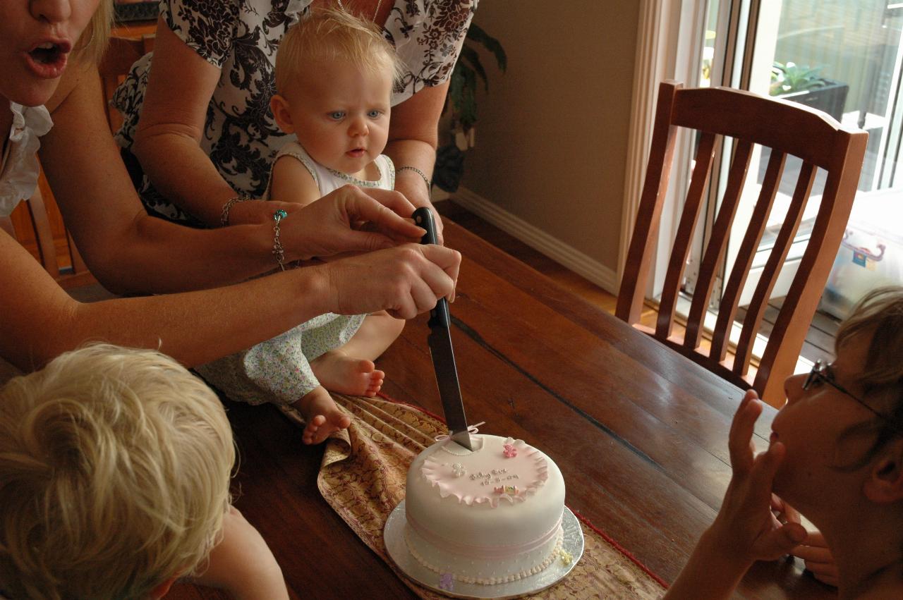 Lily's Baptism: Cutting the Baptism cake: Yvonne, Lily, Kelly, Cooper, Tynan and Flynn