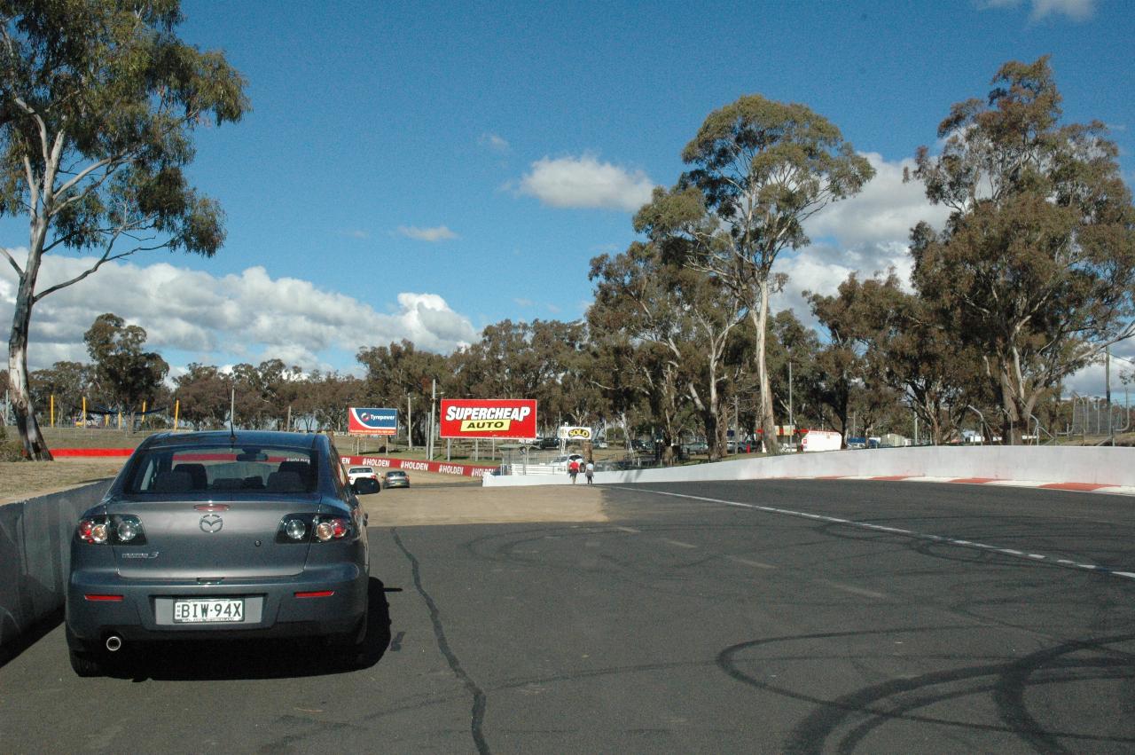 Mazda parked off side of race track