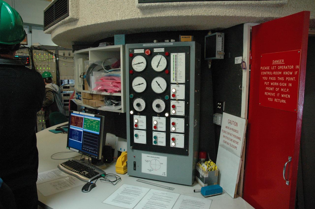 Middle of circular room with telescope control equipment