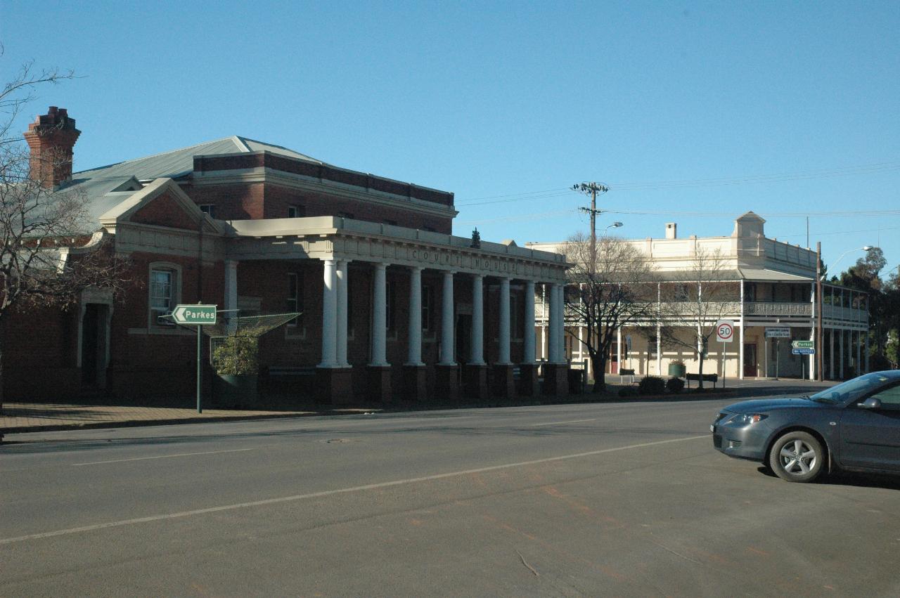 Brick building with white columns across the front