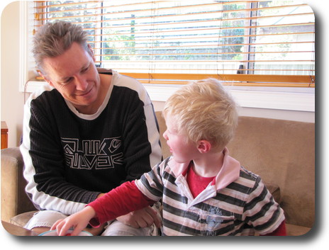 Little boy and his dad on the lounge