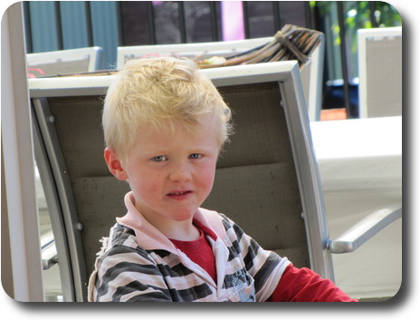 Close up of boy on trike (not visible)