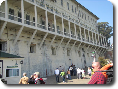 Tourists starting walk up the hill, alongside building 64