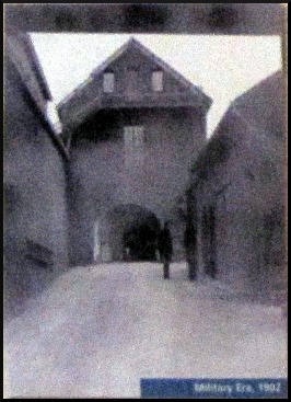 Early photo of archway guarding entrance