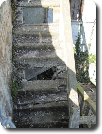 Cement stairs with man made and natural damage