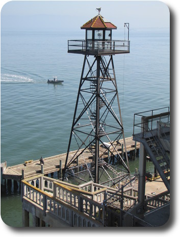 Metal tower with guard house on top, located at the dock