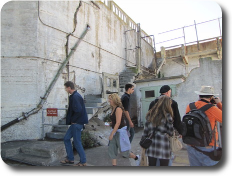 Concrete retaining wall and steps, badly weathered