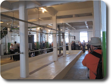 Line of people around open shower area