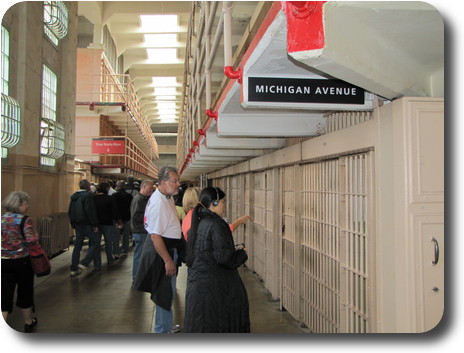 Corridor with 3 floors of cells on both sides