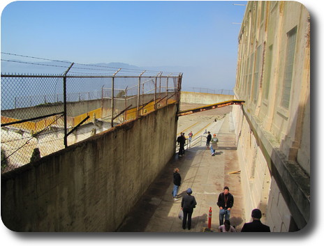 Concrete enclosure, barb wire on perimeter