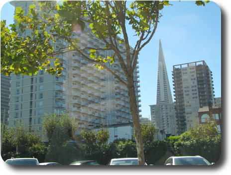 Pyramid shaped building between two others