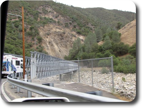 Temporary bridge over river with motorhome entering it