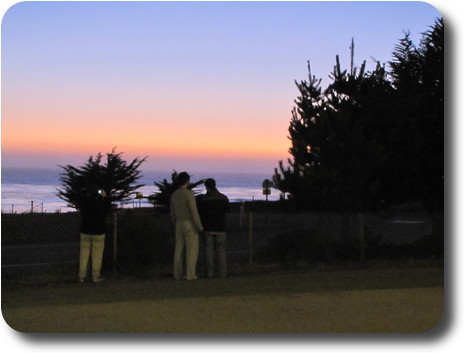 Photographers taking sunset photos, after the sun has gone but sky still light