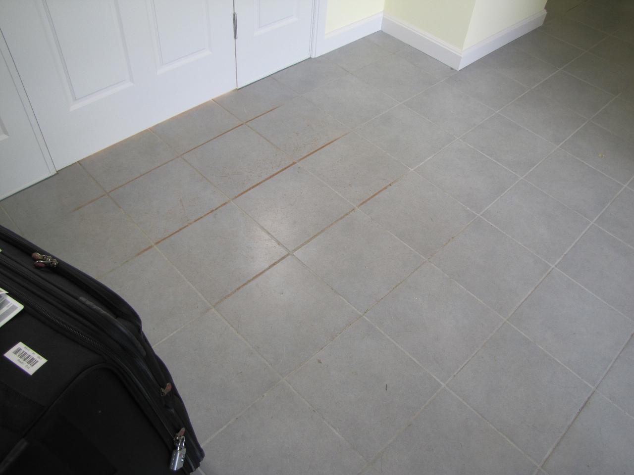 Grey floor tiles with red speckles