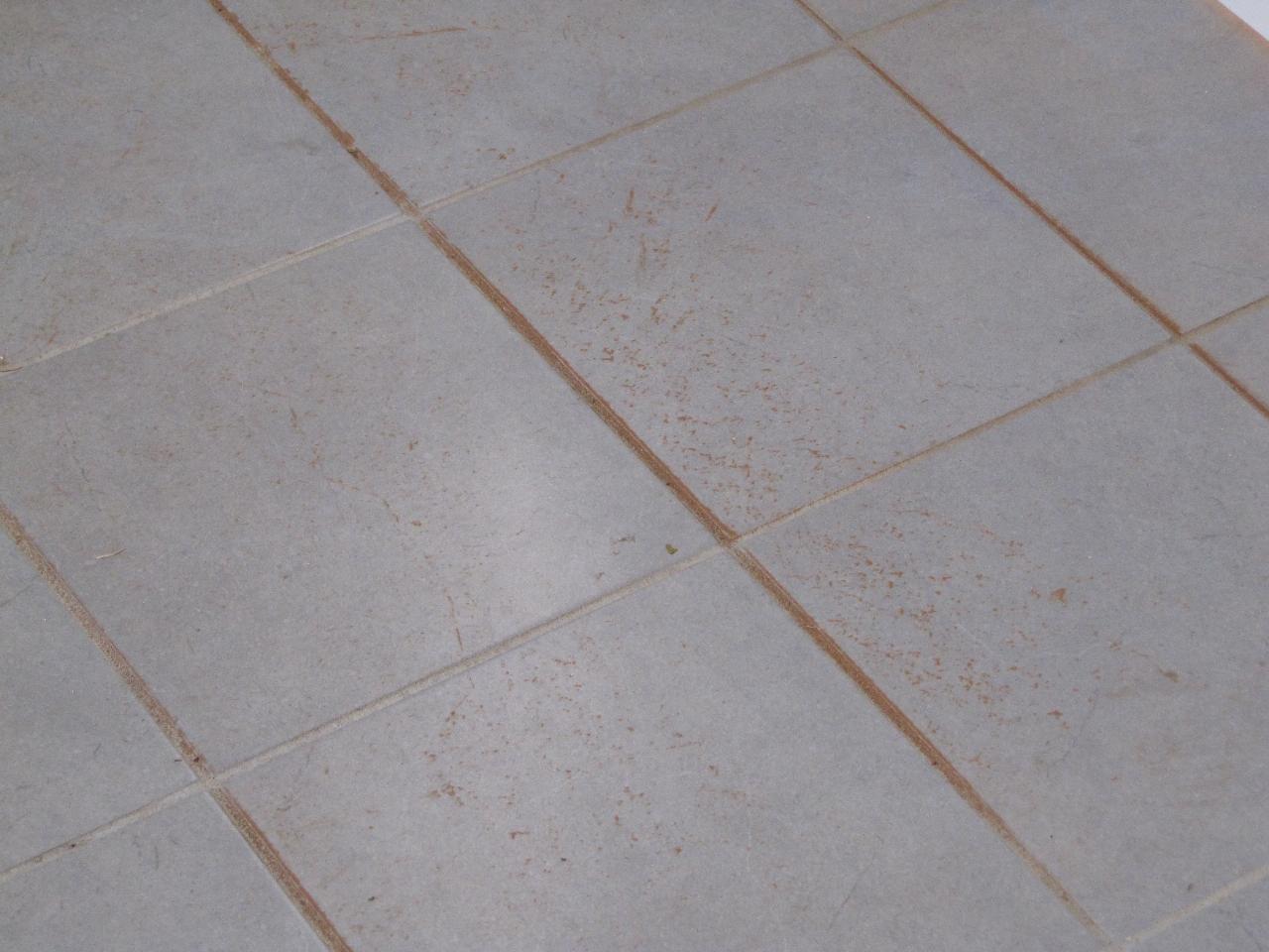 Grey floor tiles with red speckles