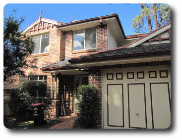 Two storey house and garage amidst trees