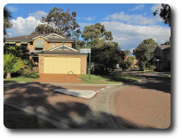 Street scene - a home, and trees along the street