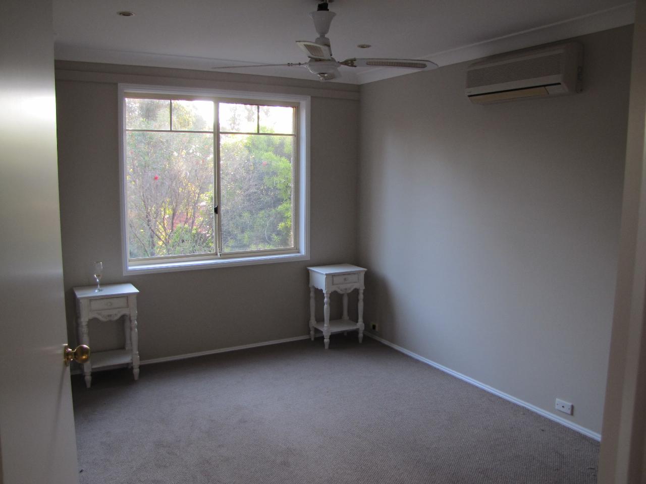 Room with window looking into trees at far end