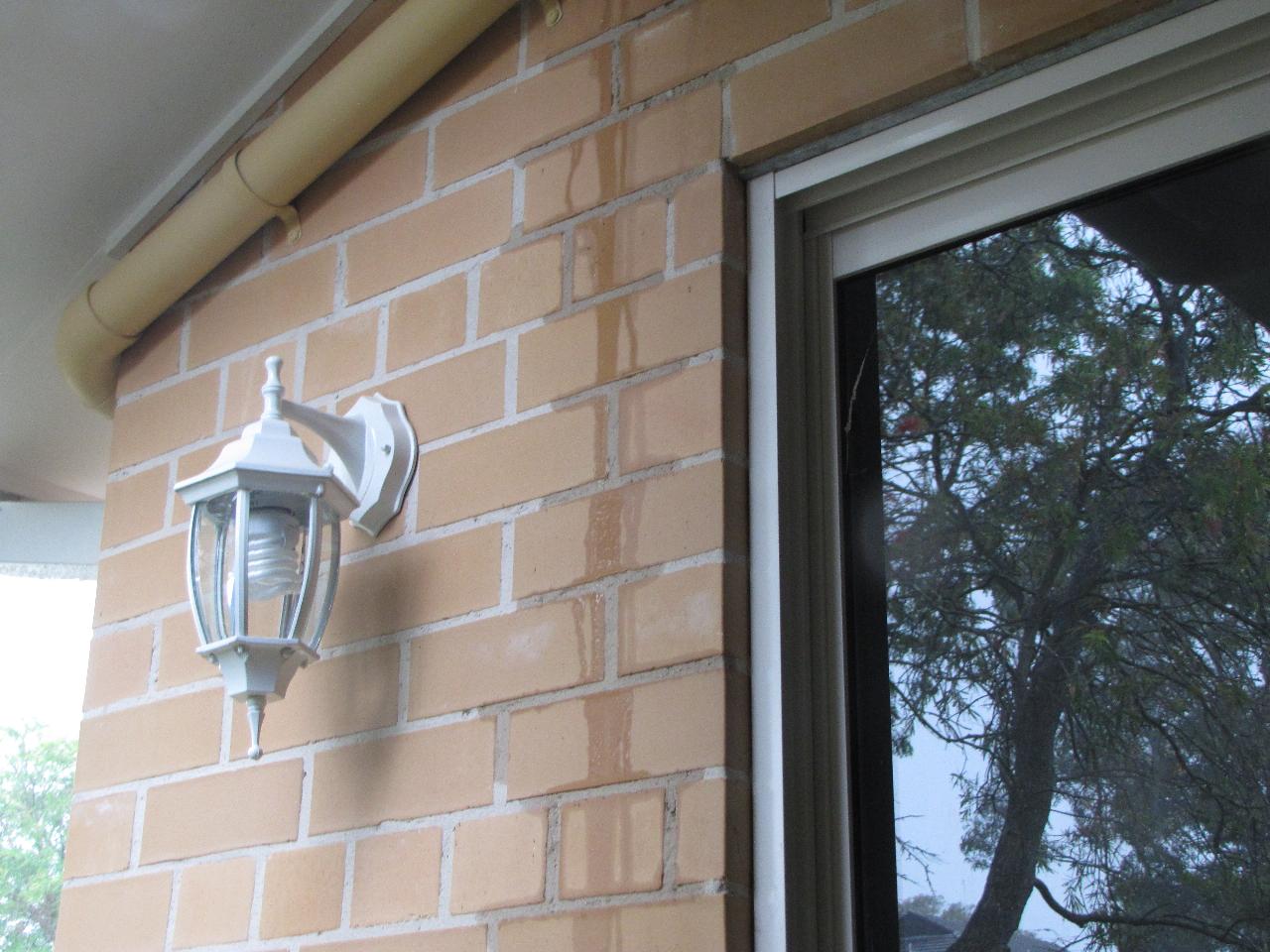 Mystery water on Wollun St home during heavy downpour (dining room wall)