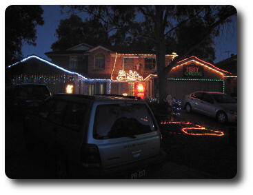 House with Christmas lights, illuminated Santa