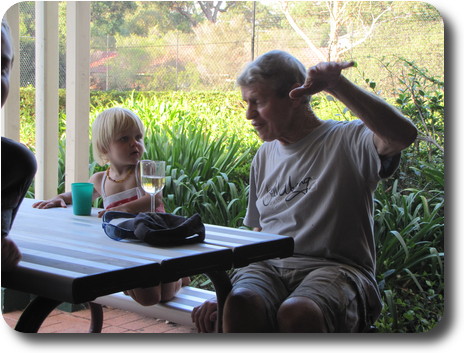 Little girl and man at picnic table