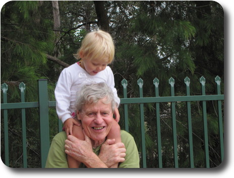 Little girl on shoulders of man