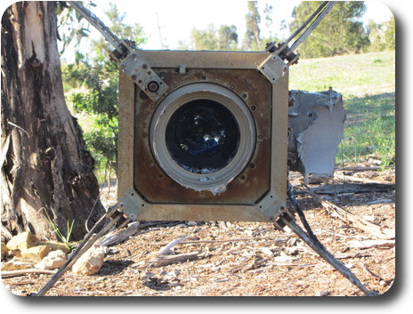 Square structure with what may be glass in the middle